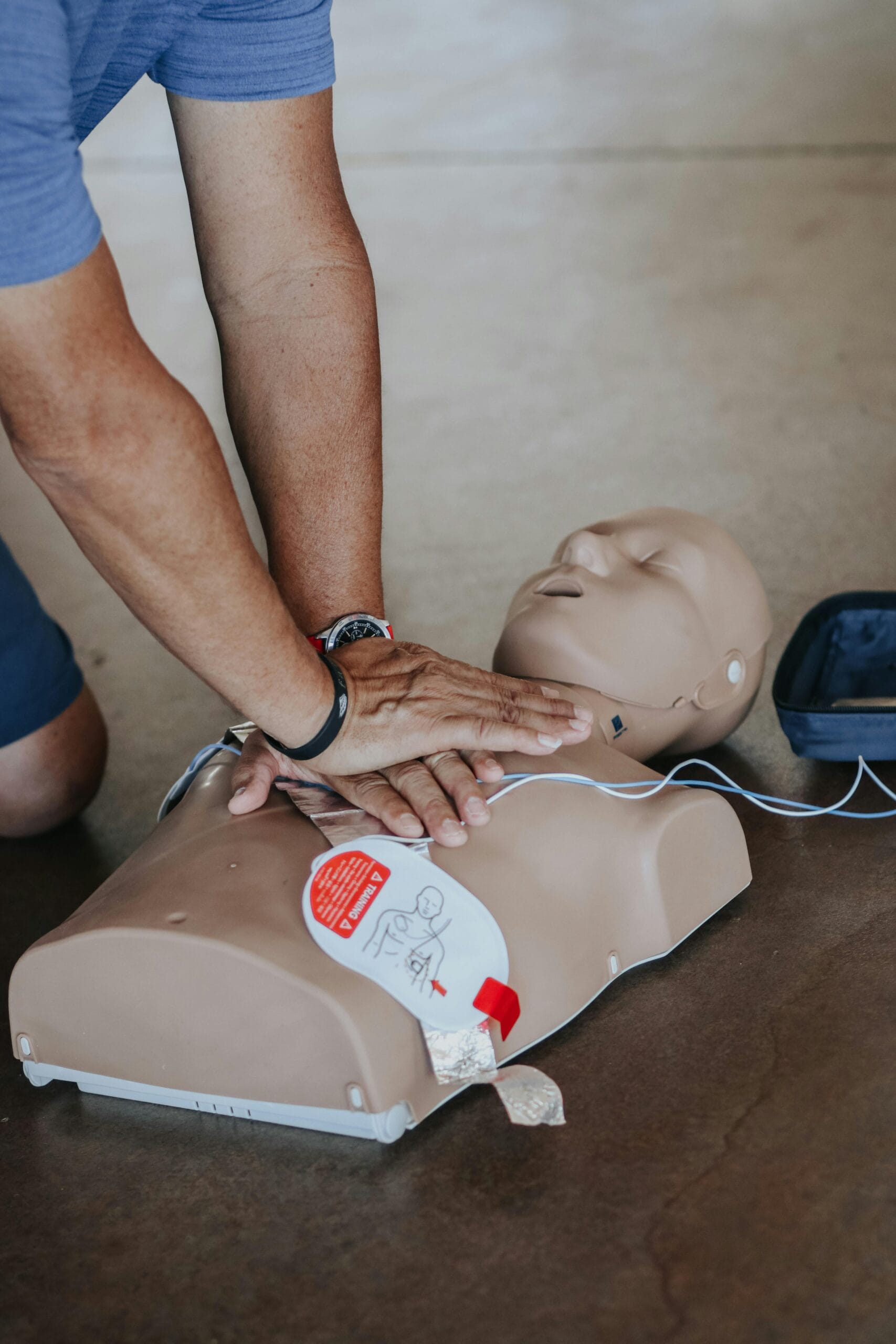 Emergency First Aid at Work CPR practice on a dummy