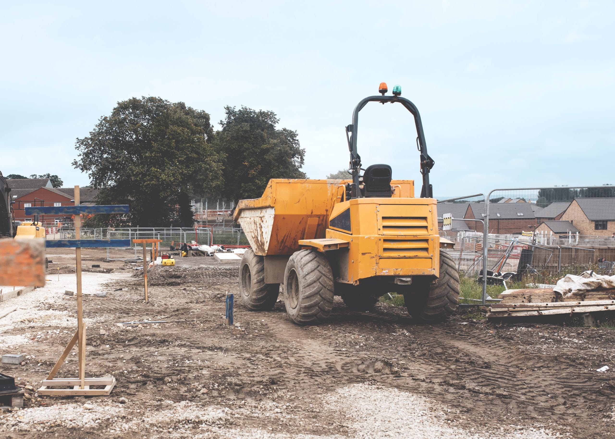 Forward Tipping Dumper on residential housing development construction site ready to transport loads